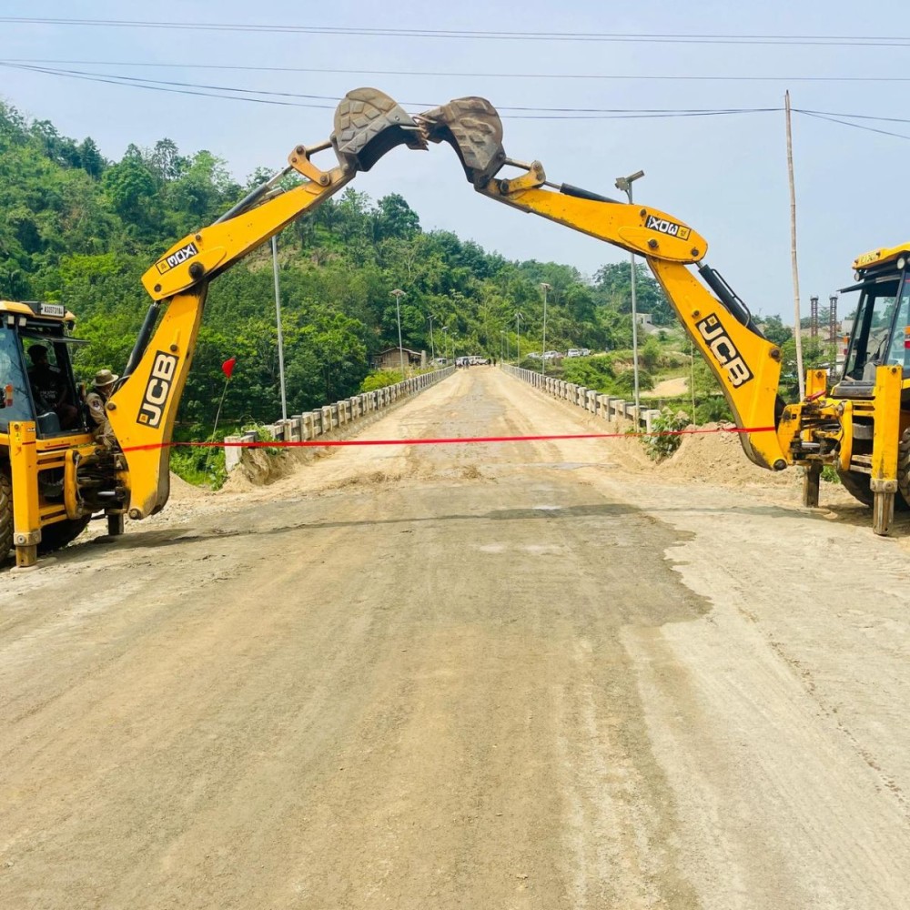 Excavators form a symbolic archway during the inauguration of the Foothill Road stretch from Doyang Bridge to the Merapani sector in Wokha district on May 23.